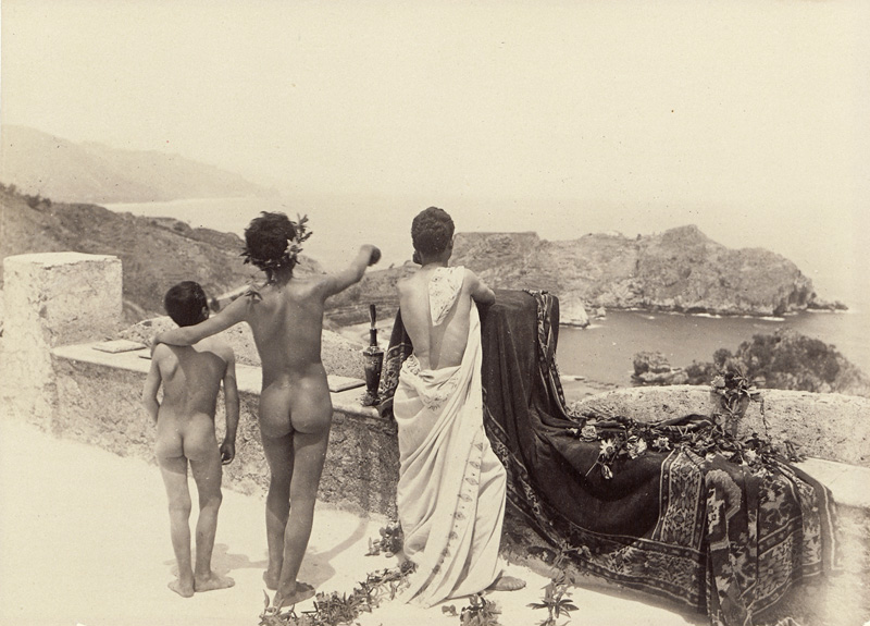 Lot 4044, Auction 126, Gloeden, Wilhelm von, Arcadian scene with a group of nude youths on terrace overlooking the sea